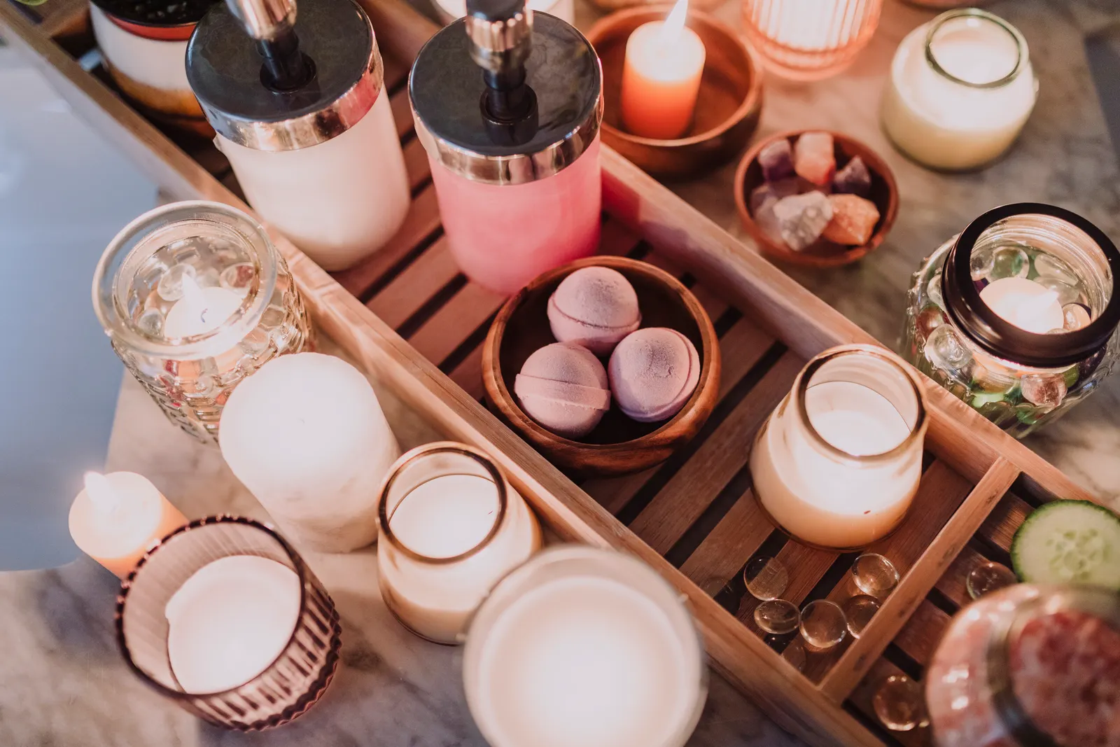 Candles, lotion and essential oils creating a cozy spa atmosphere